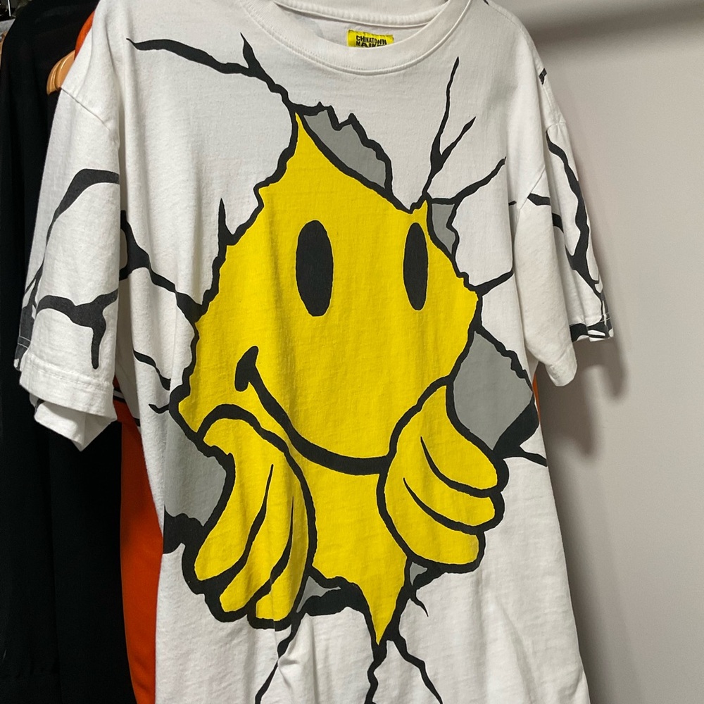 White T-Shirt with Yellow Smiley Face Graphic